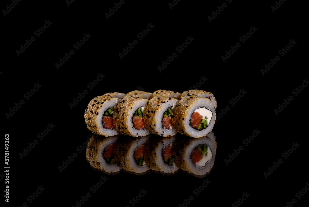 Fresh delicious beautiful sushi rolls on a dark background Fresh delicious beautiful sushi rolls on a dark background