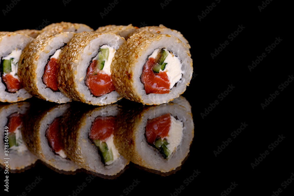 Fresh delicious beautiful sushi rolls on a dark background Fresh delicious beautiful sushi rolls on a dark background