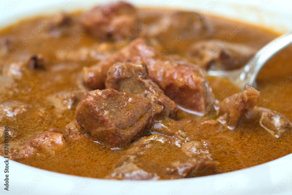 Traditional Croatian rustic meat dish - venison gulash with rich berry and mushroom sauce Traditional Croatian rustic meat dish - venison gulash with rich berry and mushroom sauce
