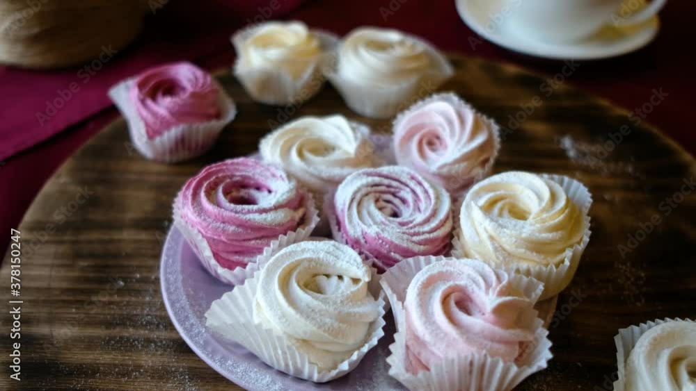 prepared meringues or marshmallows or cupcakes in pastry shop on wooden table prepared meringues or marshmallows or cupcakes in pastry shop on wooden table
