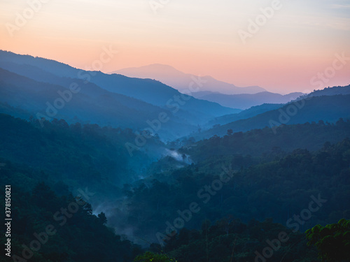Fototapeta Naklejka Na Ścianę i Meble -  beautiful nature of hills and mountain are complex with the atmosphere of the morning sunrise, at Mae Wong National park, Kamphaeng Phet, Thailand.