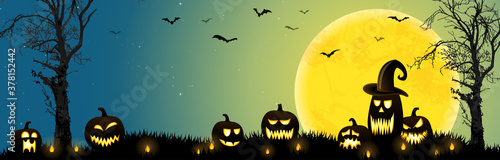 Halloween dead tree and pumpkins in front of an full moon