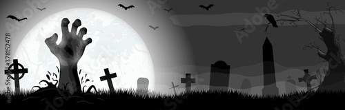 Halloween zombie hand in front of full moon