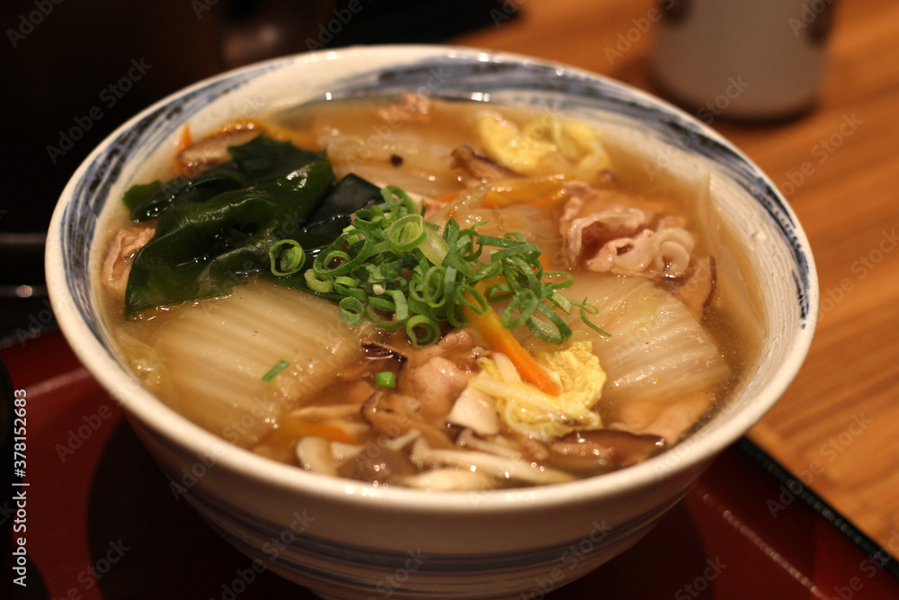 Close up of a bowl of delicious pork and vegetable udon noodles, Fukuoka, Japan, soft focus Close up of a bowl of delicious pork and vegetable udon noodles, Fukuoka, Japan, soft focus