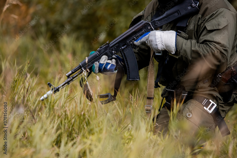 A soldier's Kalashnikov assault rifle, fighting, anti-terror, Special forces team. Russian police (Spetsnaz). A soldier's Kalashnikov assault rifle, fighting, anti-terror, Special forces team. Russian police (Spetsnaz).