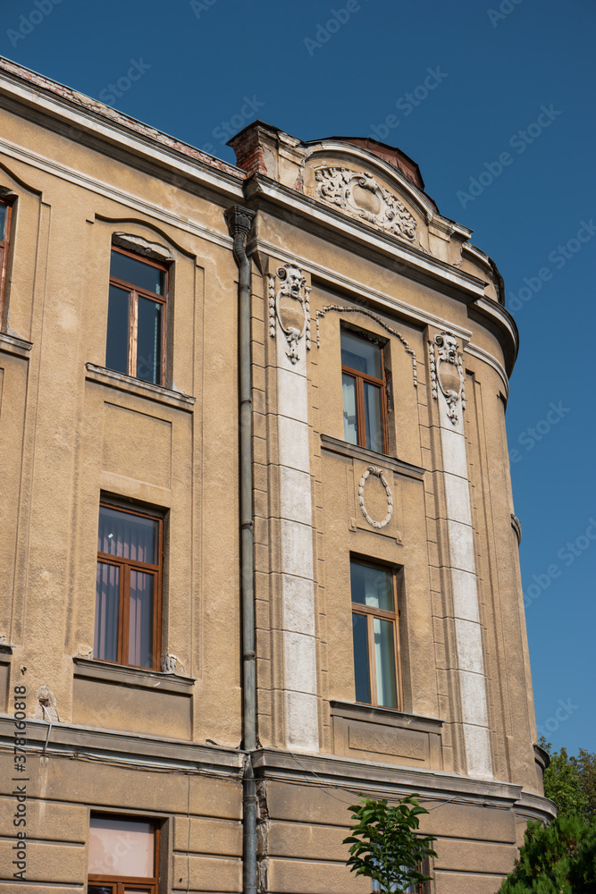 20'th Century European old building facade with decaying ornaments 20'th Century European old building facade with decaying ornaments