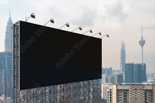 Canvas Print Blank black road billboard with Kuala Lumpur cityscape background at day time