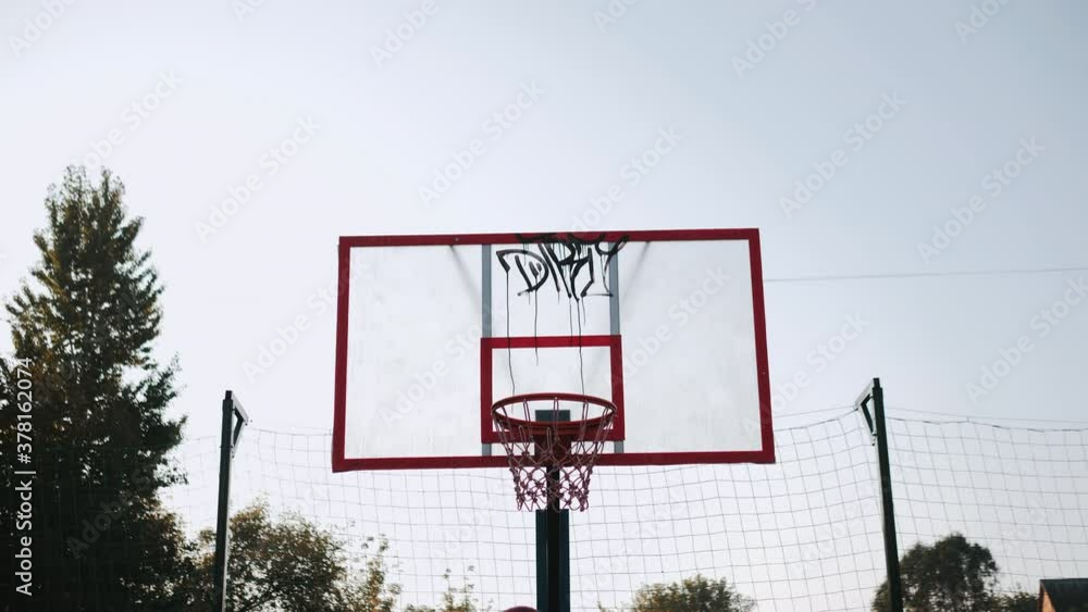 Street basketball successful throw in close up Street basketball successful throw in close up
