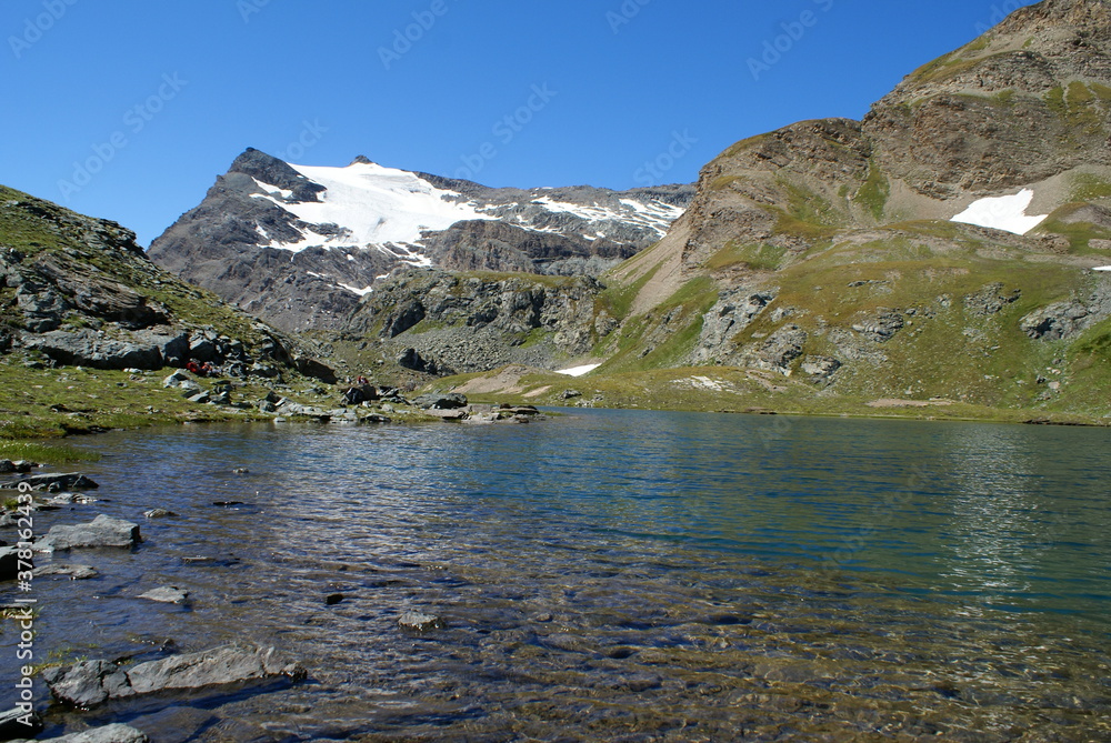 Colle del Nivolet, Italy: panorama with mountains and lake