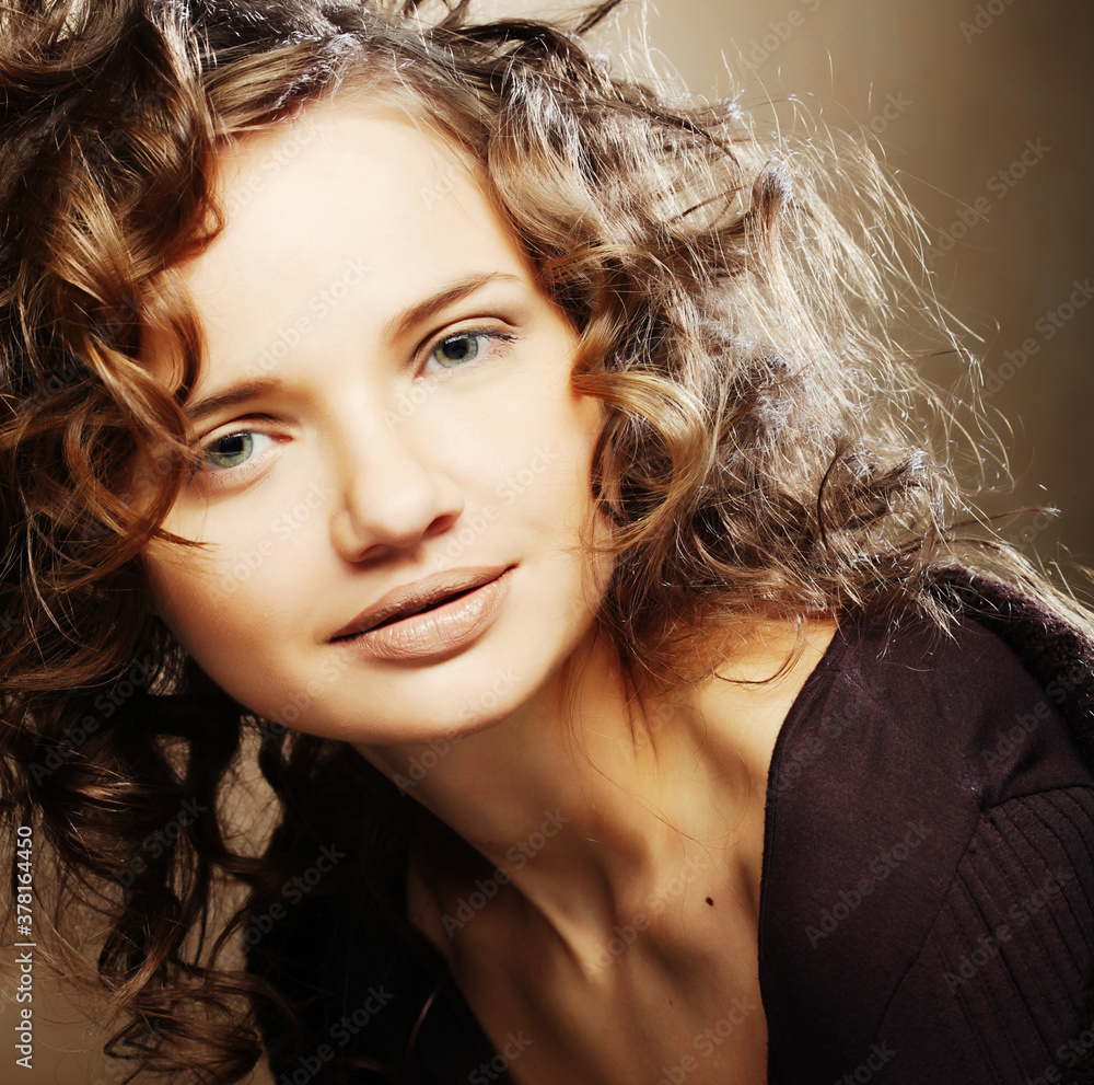Fototapeta premium beautiful young woman with curly hair