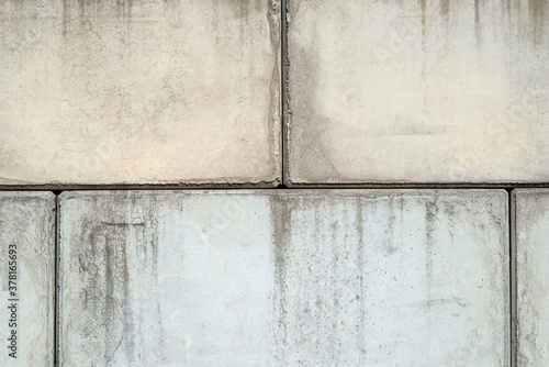 Background, texture made of large concrete blocks with visible joints, close-up photo.