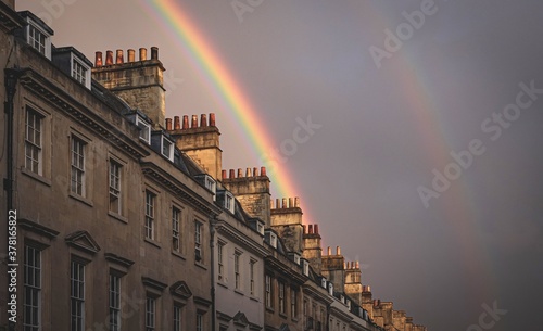 Background with rainbow over the buildings of Bath in the united kingdom.