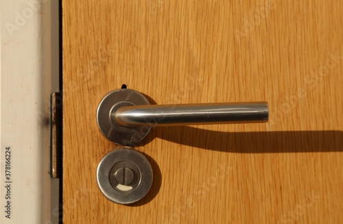 Wallpaper Mural A metal door handle on an internal door. Torontodigital.ca