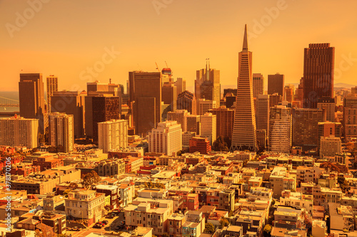 Smoky orange sky of San Francisco skyline. California fires in September 2020 in United States. wildfires composition.