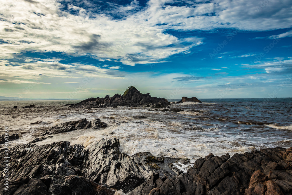 rocky sea beach with crashing waves and amazing sky at morning from flat angle rocky sea beach with crashing waves and amazing sky at morning from flat angle