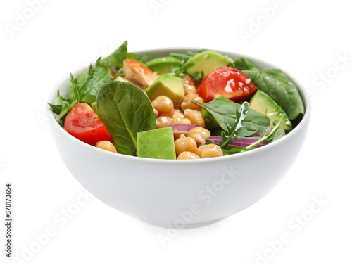 Delicious salad with avocado and chickpeas in bowl on white background