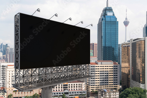 Photography Blank black road billboard with Kuala Lumpur cityscape background at day time