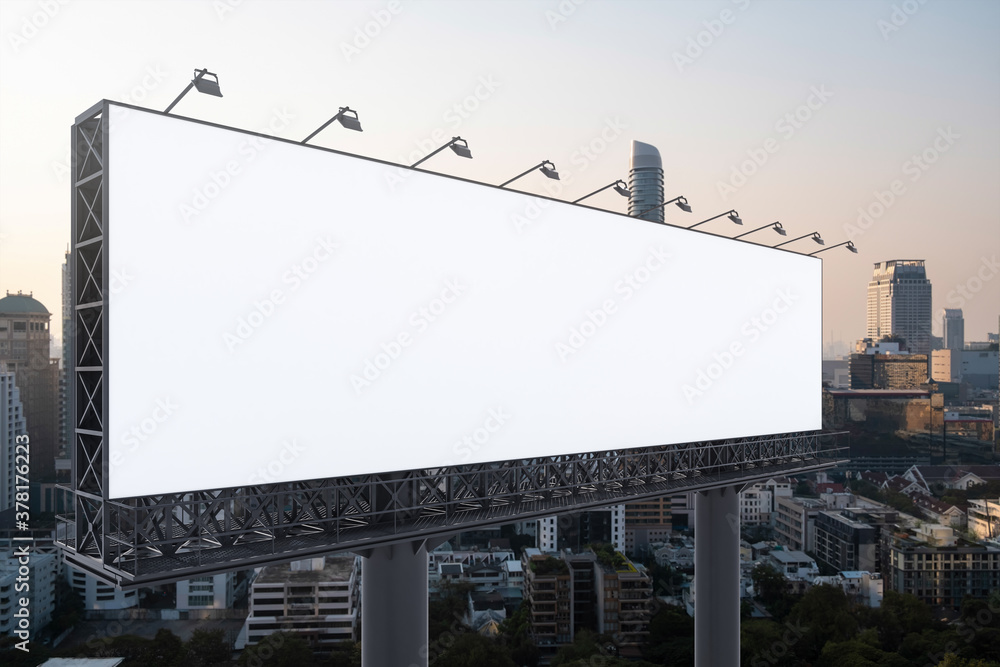 Blank white road billboard with Bangkok cityscape background at sunset. Street advertising poster, mock up, 3D rendering. Side view. The concept of marketing communication to promote or sell idea. Blank white road billboard with Bangkok cityscape background at sunset. Street advertising poster, mock up, 3D rendering. Side view. The concept of marketing communication to promote or sell idea.