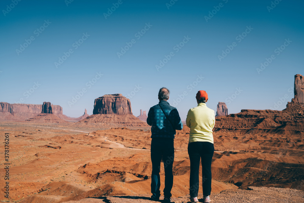 Couple of tourists enjoying picturesque view of valley