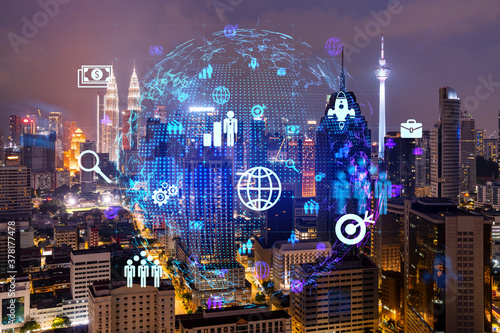 Canvas Print Glowing Social media icons on night panoramic city view of Kuala Lumpur, Malaysia, Asia
