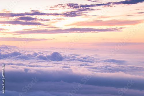View at sunrise with puffy foggy. White puffy like cloud stretching to foggy horizon in the bright morning.