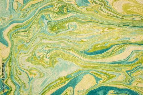 Fotografie background of gold, green and blue Nepalese lokta paper Inspired from the grain