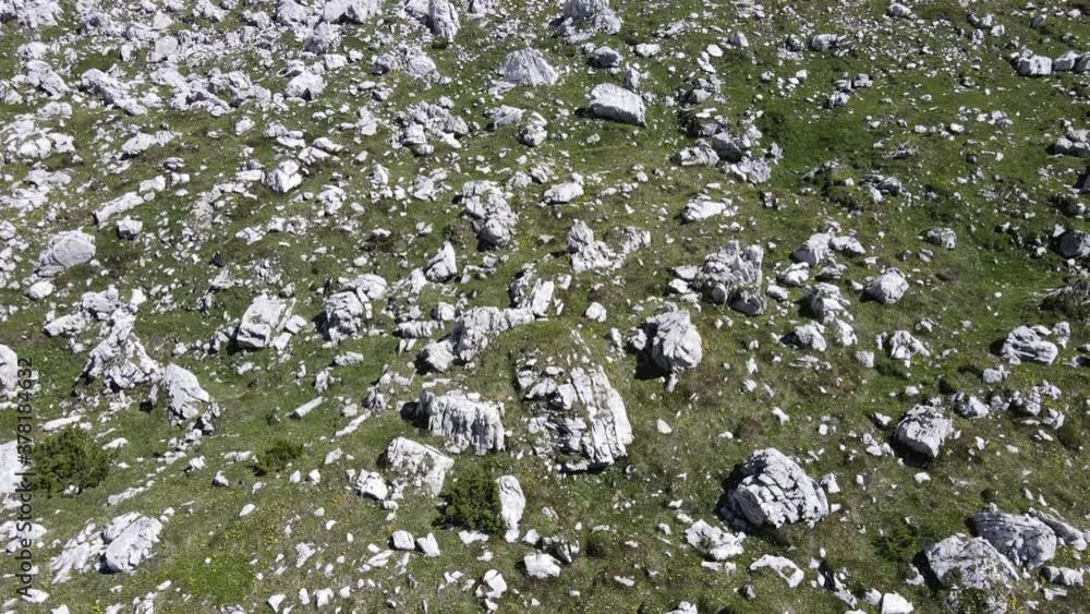 4k video of dolomites mountains, italian alps. rocky landscapes, snow-capped peaks, green meadows, blue sky. the spectacular valleys with unspoiled nature 4k video of dolomites mountains, italian alps. rocky landscapes, snow-capped peaks, green meadows, blue sky. the spectacular valleys with unspoiled nature