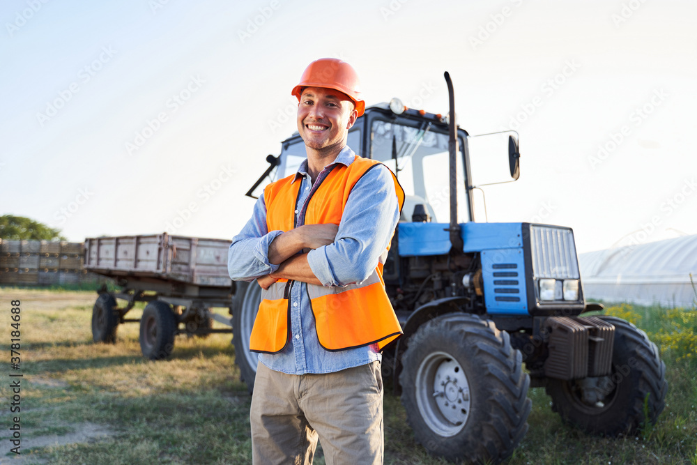 Employee in orange jacket near vehicle Employee in orange jacket near vehicle
