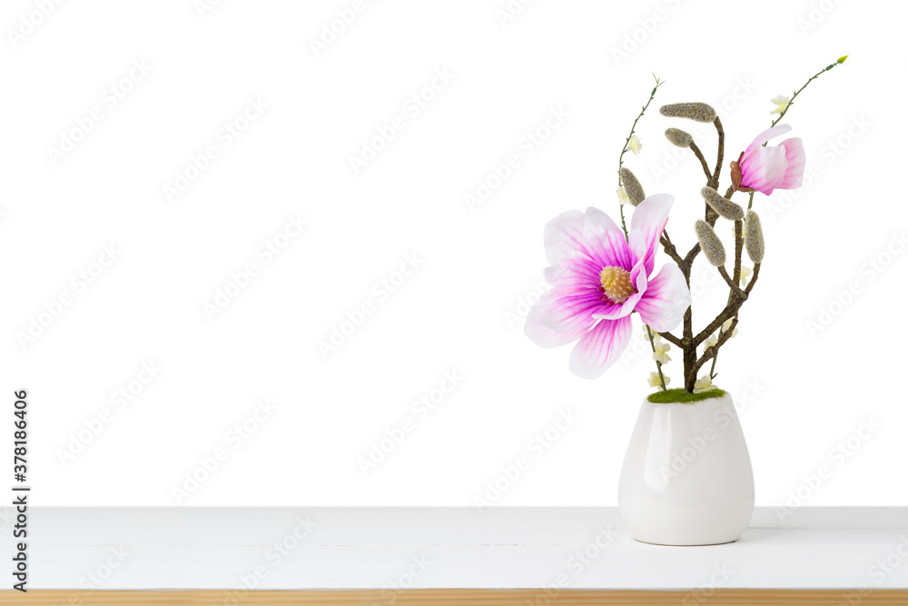 Decorative Pink Flower in vase on table isolated white background