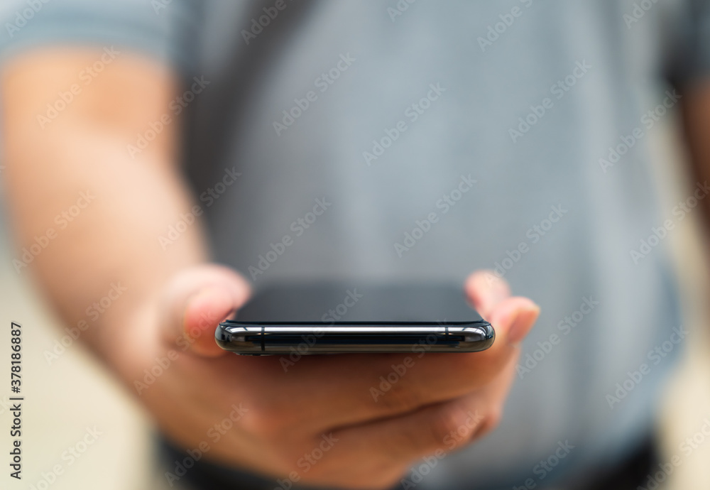 Close Up man hand holding using smartphone