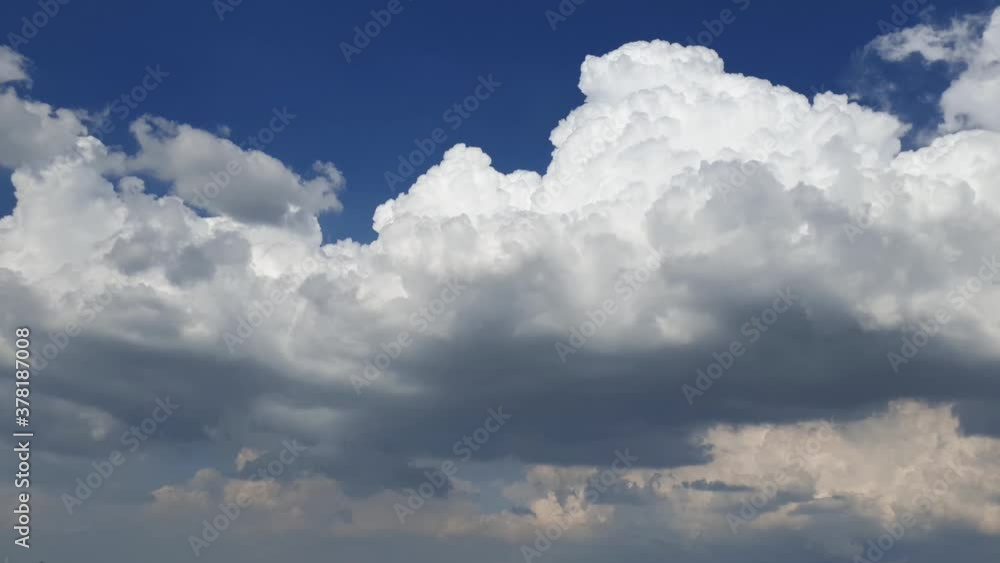 Epic large thunderstorm rain clouds formation, rolling and forming miles high in summer sky time lapse. Epic large thunderstorm rain clouds formation, rolling and forming miles high in summer sky time lapse.