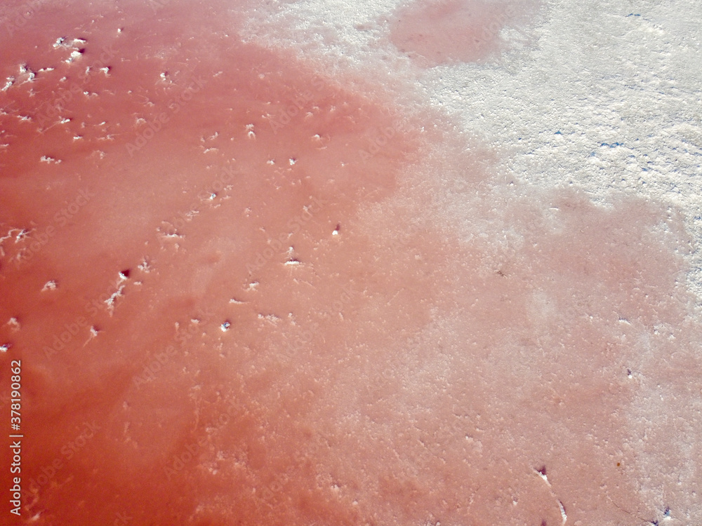 Pink water and salt on a pink lake in Spain.