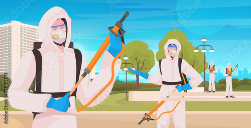 professional cleaners in hazmat suits janitors team disinfecting virus cells to prevent coronavirus pandemic urban park cityscape background horizontal vector illustration