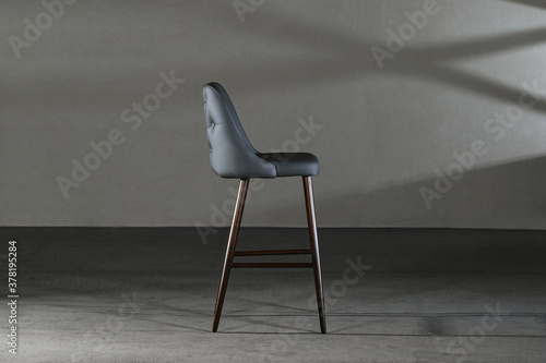 Obraz na plátně Closeup of an armless chair with a concave back, loft-style furniture