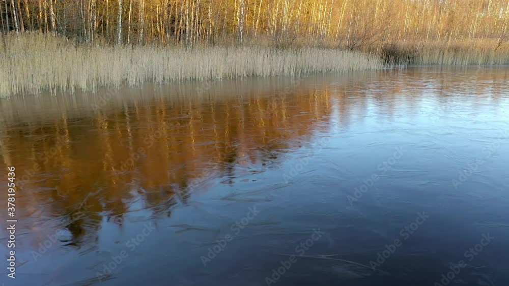The thin ice on the water of the lake in Finland.aerial shot The thin ice on the water of the lake in Finland.aerial shot