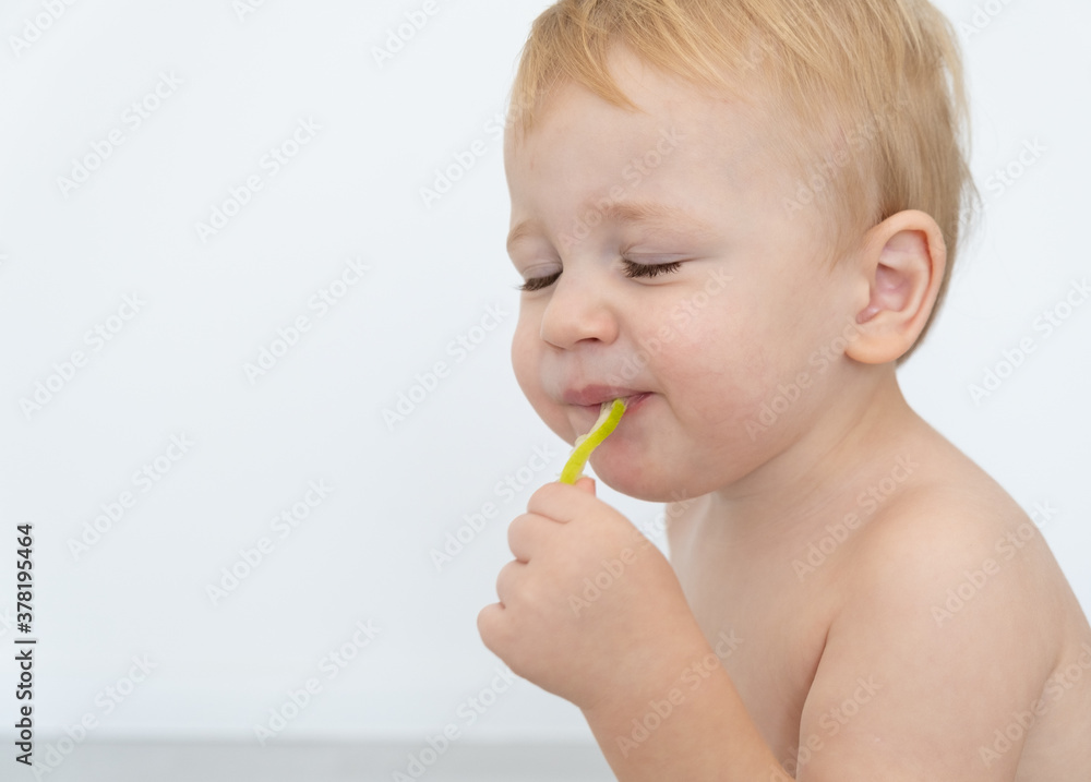 Baby boy trying and tasting new food. Dieting, vegetarian and healthy nutrition concept. Baby boy trying and tasting new food. Dieting, vegetarian and healthy nutrition concept.