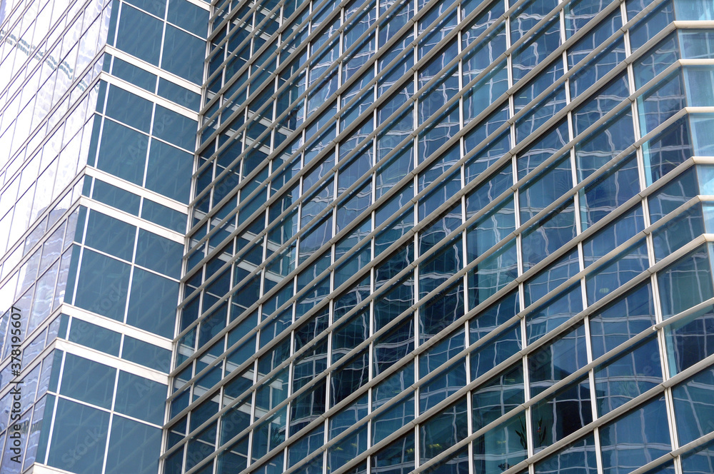 Skyscraper facade with glass facade and reflections. Skyscraper facade with glass facade and reflections.