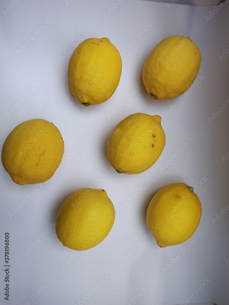 Lemon or lime limon on a white paper background. Lemon or lime limon on a white paper background.
