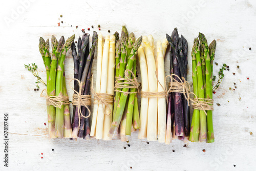 Asparagus. Raw organic asparagus brunch. Top view. Free space for your text.