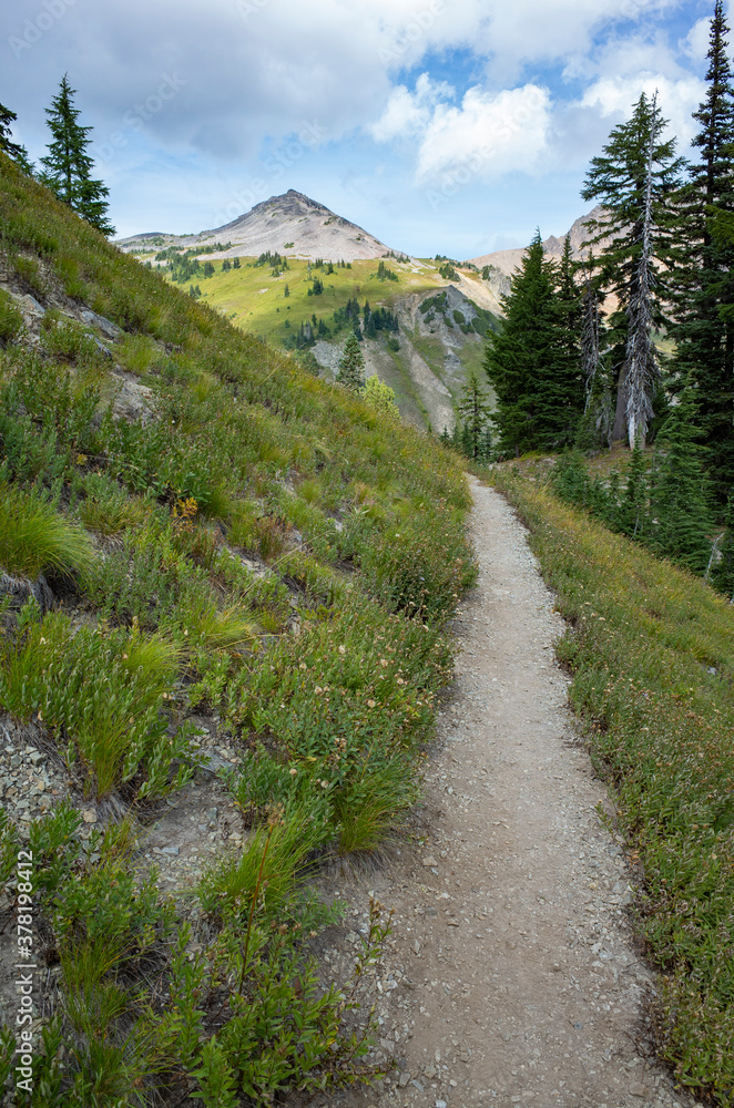 Hiking trail across vast mountain range Hiking trail across vast mountain range