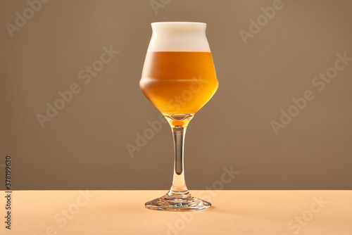 Goblet with cold amber ale photo