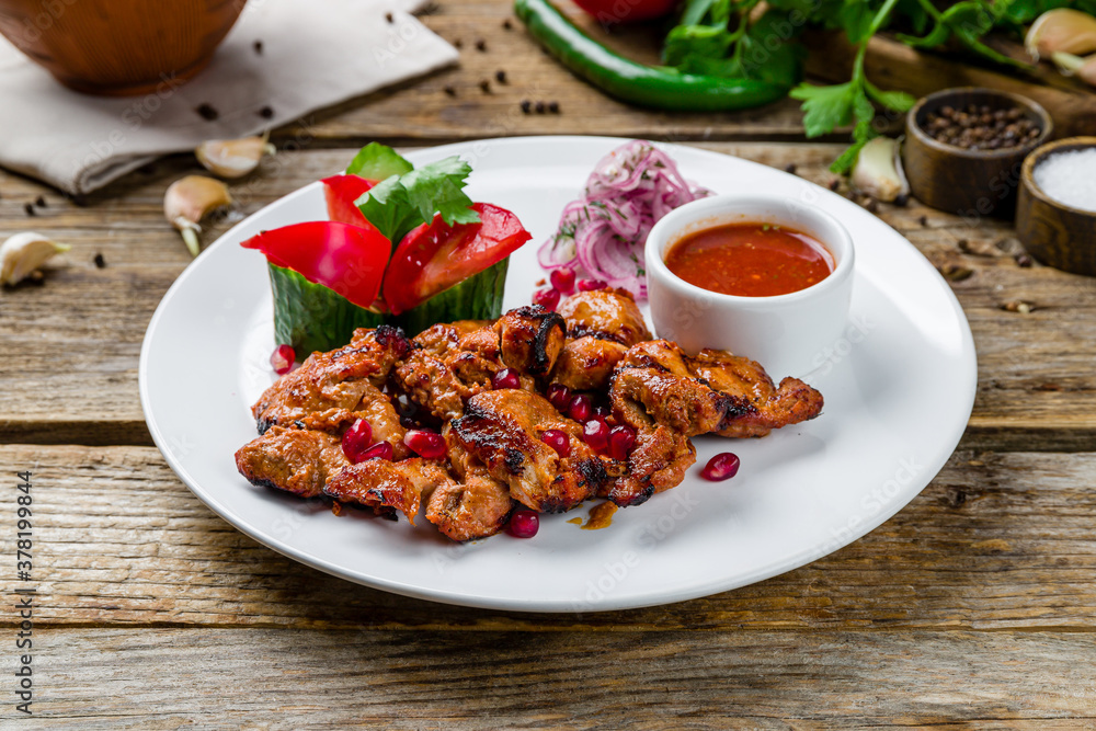 Kebab of pork on old wooden table Kebab of pork on old wooden table