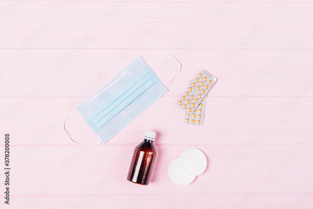 Flat lay COVID-19 prevention set with medical face mask Flat lay COVID-19 prevention set with medical face mask