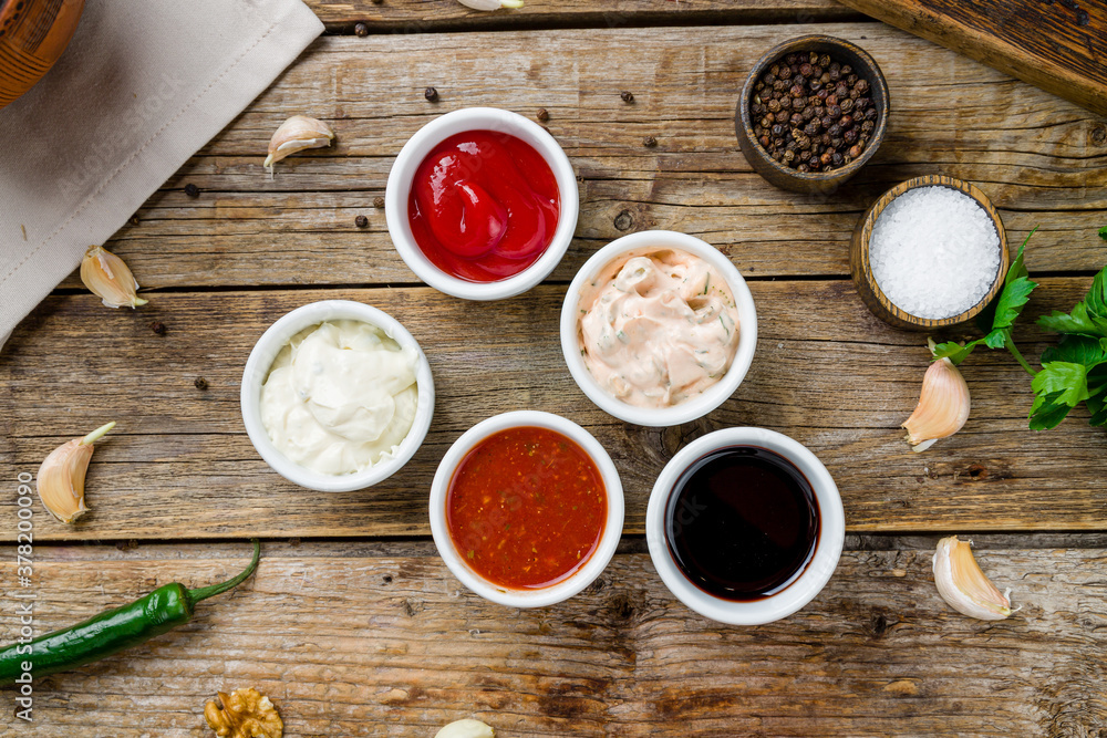 assorted sauces top view on old wooden table assorted sauces top view on old wooden table