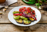 grilled vegetables on a plate on old wooden table