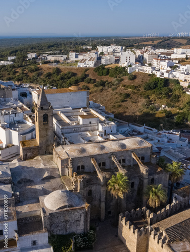 Aerial drone image of a white andalusian town in south Spain with church