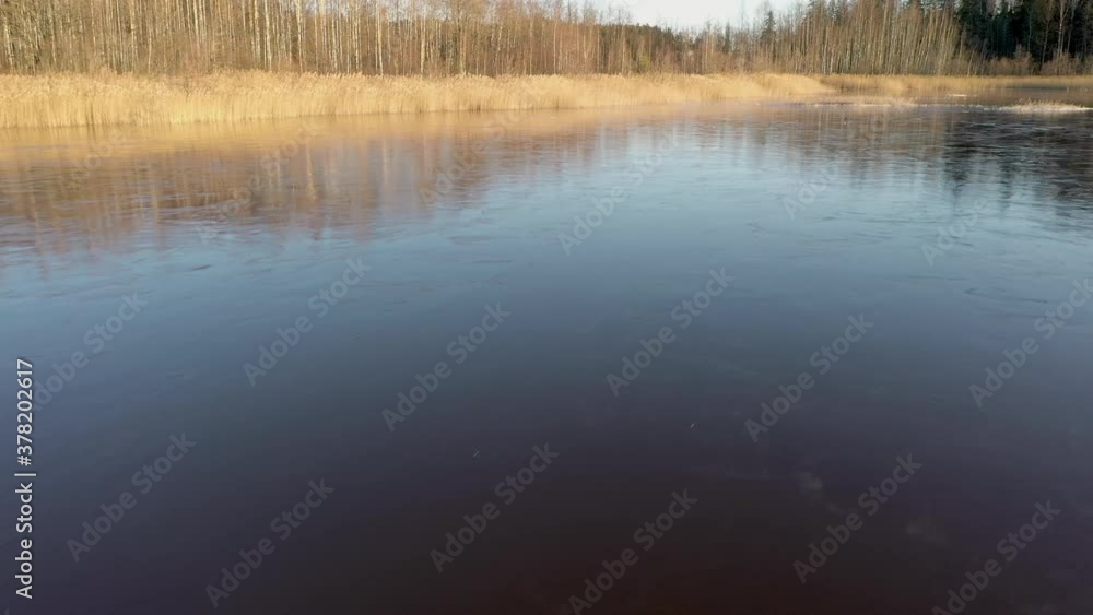 The aerial shot of the thin ice on the lake water in Finland.aerial shot The aerial shot of the thin ice on the lake water in Finland.aerial shot