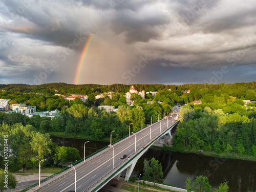 Aerial view of a rainbow over Zirmunai Bridge across Neris River, connecting Zirmunai and Antakalnis districts of Vilnius, Lithuanian. photo