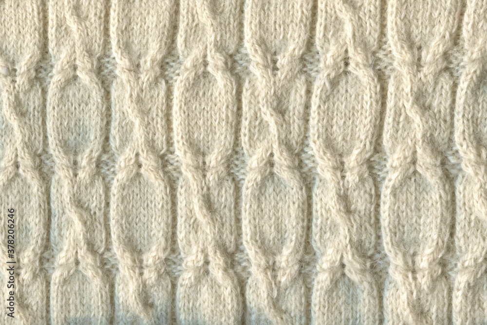 Pure milk-colored wool, bound with a three-dimensional pattern. Hand knitting, hobby. Warm, winter sweater, tied with a pattern of braids.