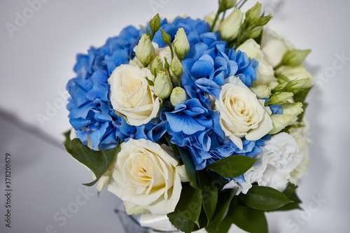 Exquisite bouquet of white roses and blue flowers © Vasyl
